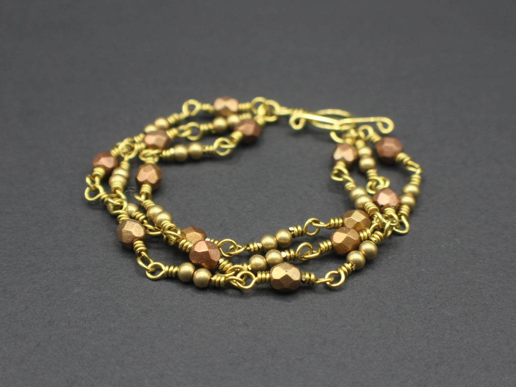 Handcrafted Triple Strand Metallic Faceted Glass and Brass Bracelet with Toggle Clasp, 6.5"