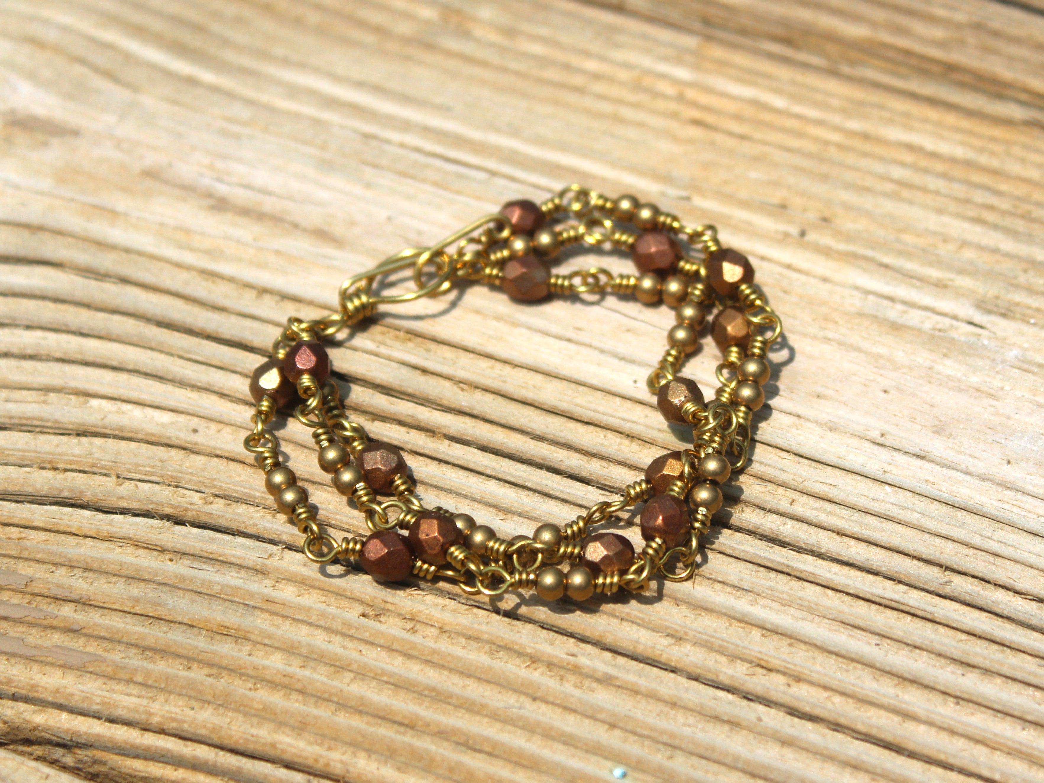 Handcrafted Triple Strand Metallic Faceted Glass and Brass Bracelet with Toggle Clasp, 6.5"