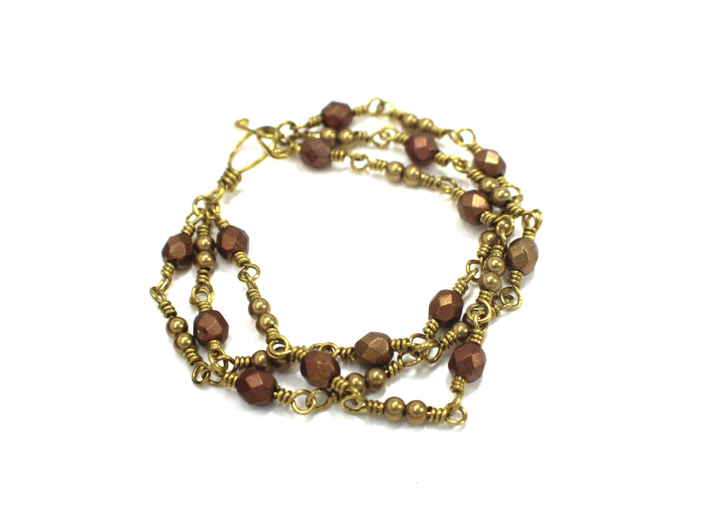 Handcrafted Triple Strand Metallic Faceted Glass and Brass Bracelet with Toggle Clasp, 6.5"