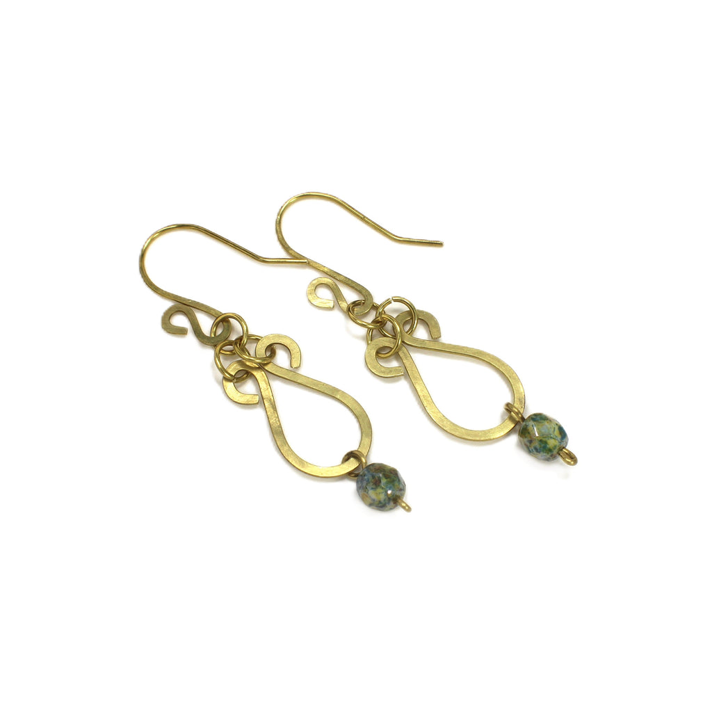 Hammered brass teardrop earrings with mottled yellow/blue bead drops on a white background