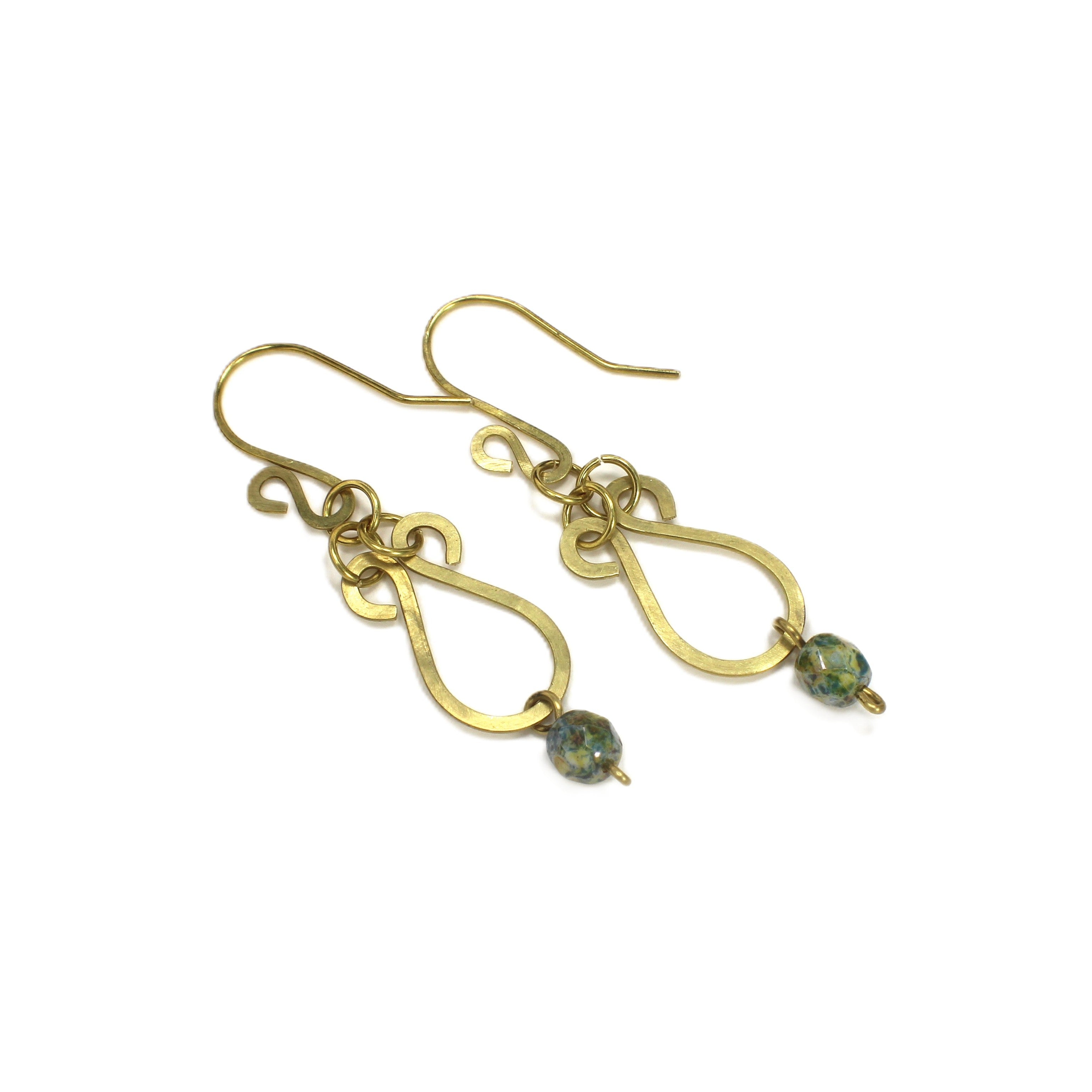Hammered brass teardrop earrings with mottled yellow/blue bead drops on a white background