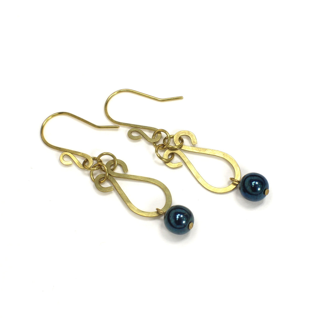 Hammered brass teardrop earrings with metallic dark teal bead drops on a white background