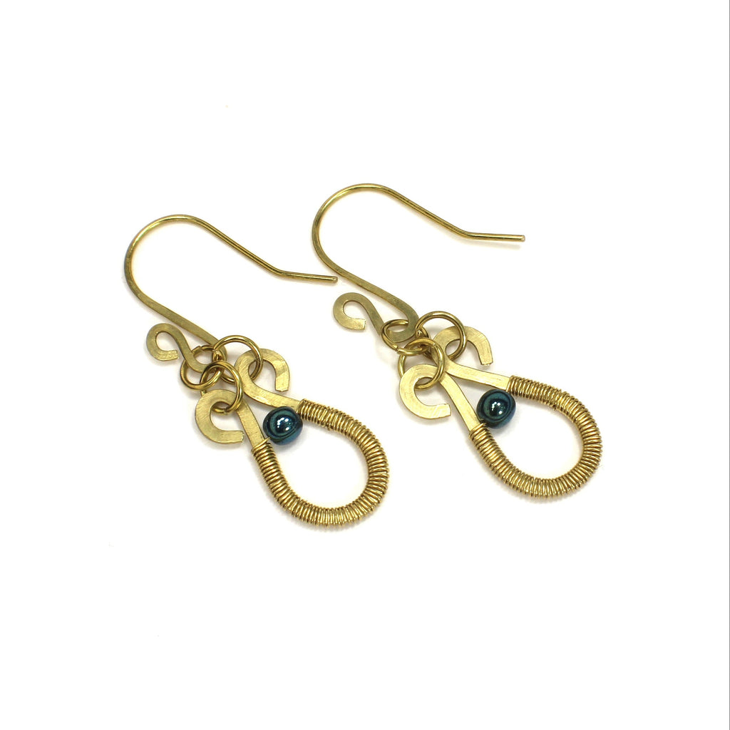 Hammered brass teardrop earrings wire-wrapped with metallic teal bead accents on a white background