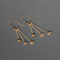 Handcrafted Triple Spiral Dangle Earrings in Copper